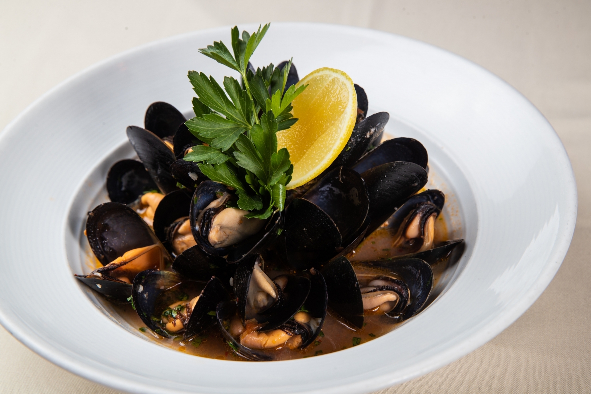 steamed mussels in light tomato broth