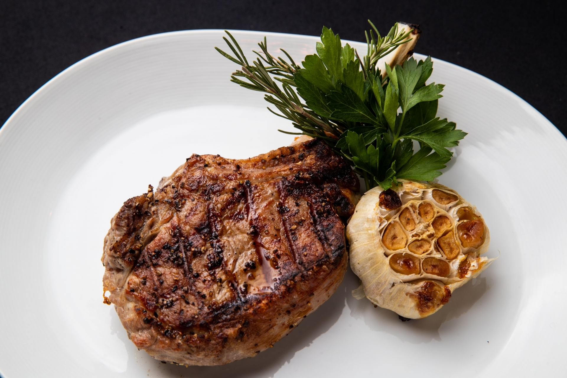 Grilled Veal Chop with herb roasted garlic