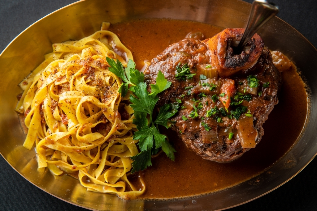 Osso Bucco veal shank in a red wine porcini mushroom sauce with fettuccine pasta.
