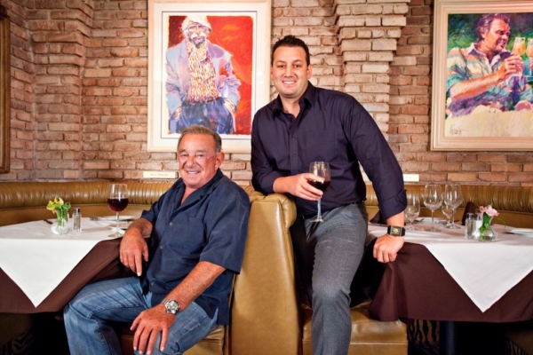Freddie Glusman (seated) with Evan Glusman are Pieo's Owners Are Piero's Italian Food Experts