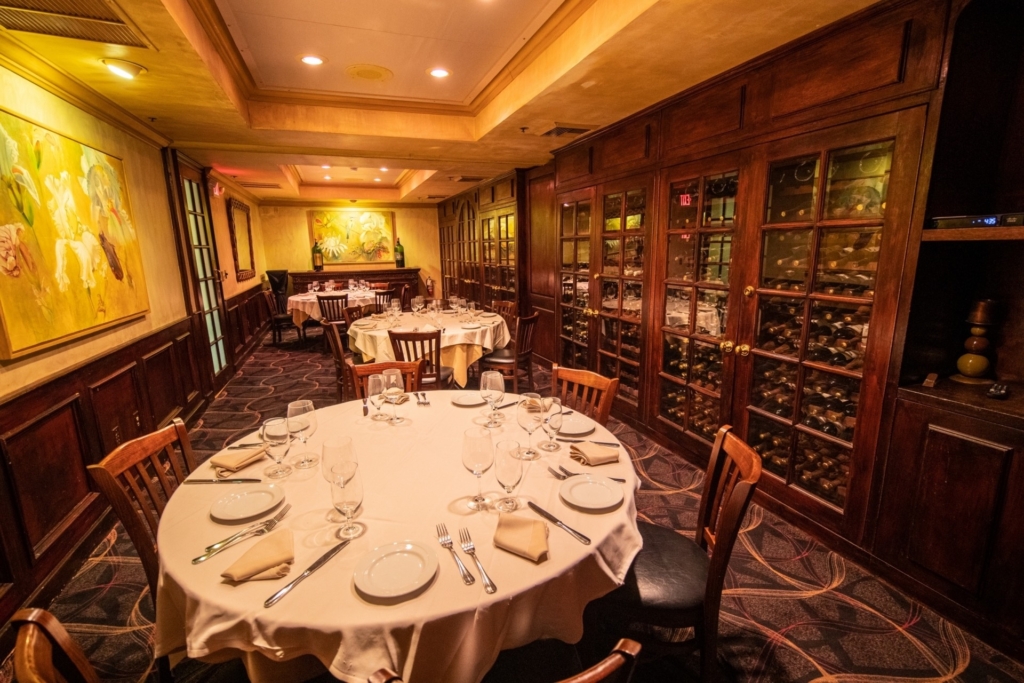 Wine cellar room with round tables. A private dining favorite at Piero's Italian Cuisine.